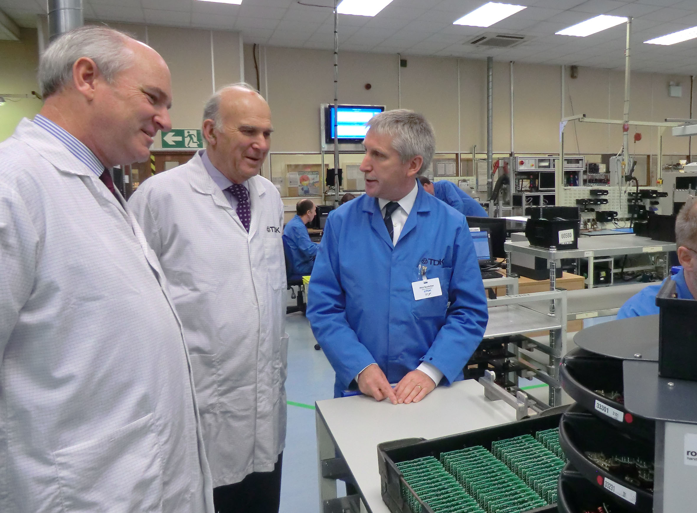 Business Secretary Dr Vince Cable, accompanied by North Devon MP Sir Nick Harvey, speaks to Phil Scotcher, General Manager of TDK-Lambda UK